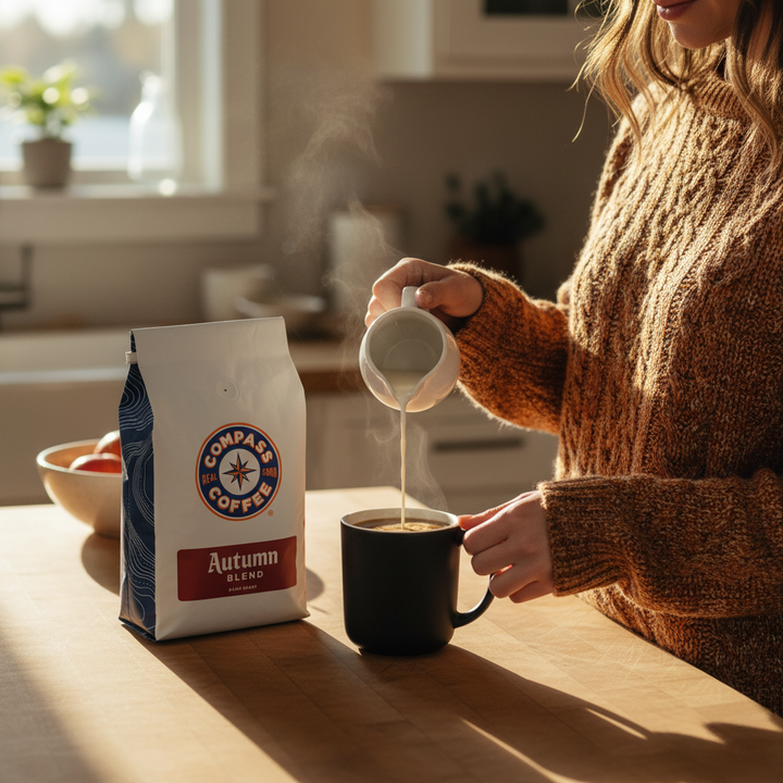 Woman pouring cream into mug of coffee
