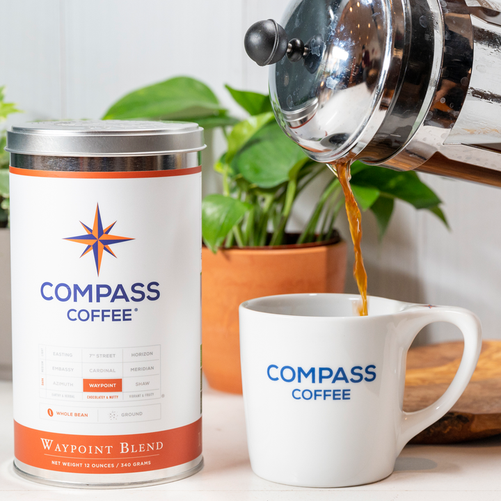 Waypoint whole bean French Press pouring into a Compass Coffee mug